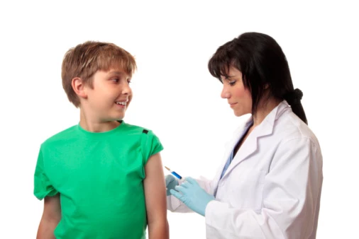 Happy boy getting immunization shot