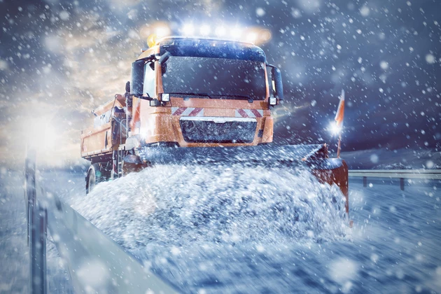Professional snowplow on a snowy road